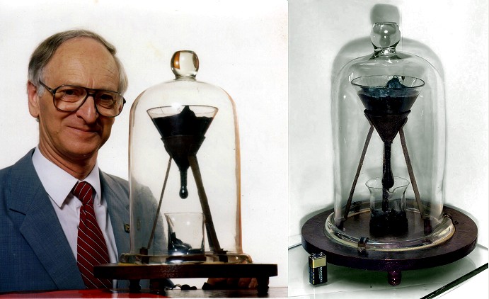 http://upload.wikimedia.org/wikipedia/commons/0/03/Pitch_drop_experiment_with_John_Mainstone.jpg